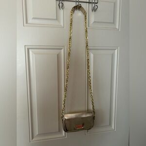 GUC Lilly gold crossbody purse.
